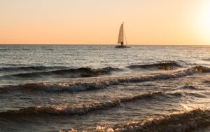 boat, sailing, sea, sunset, sunlight, waves, sail, nature, sailboat, sailing boat, vessel, horizon, ocean, water, seascape, dusk, scenic
